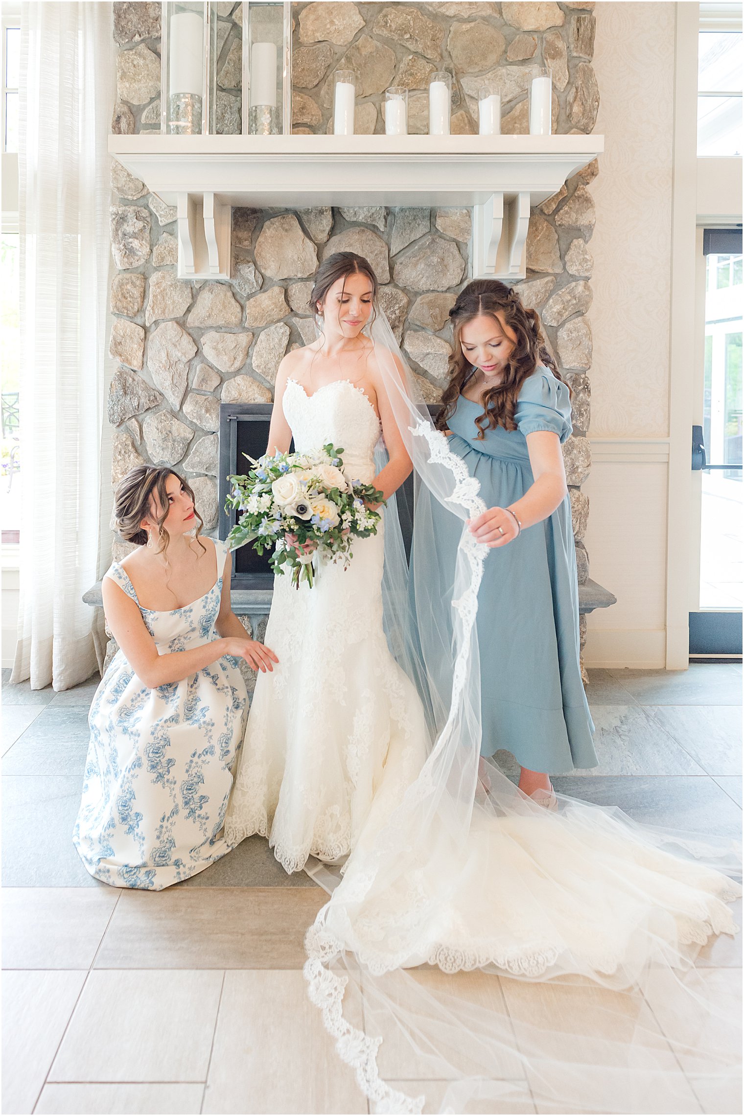 bridesmaids help bride with veil before Indian Trail Club wedding celebration