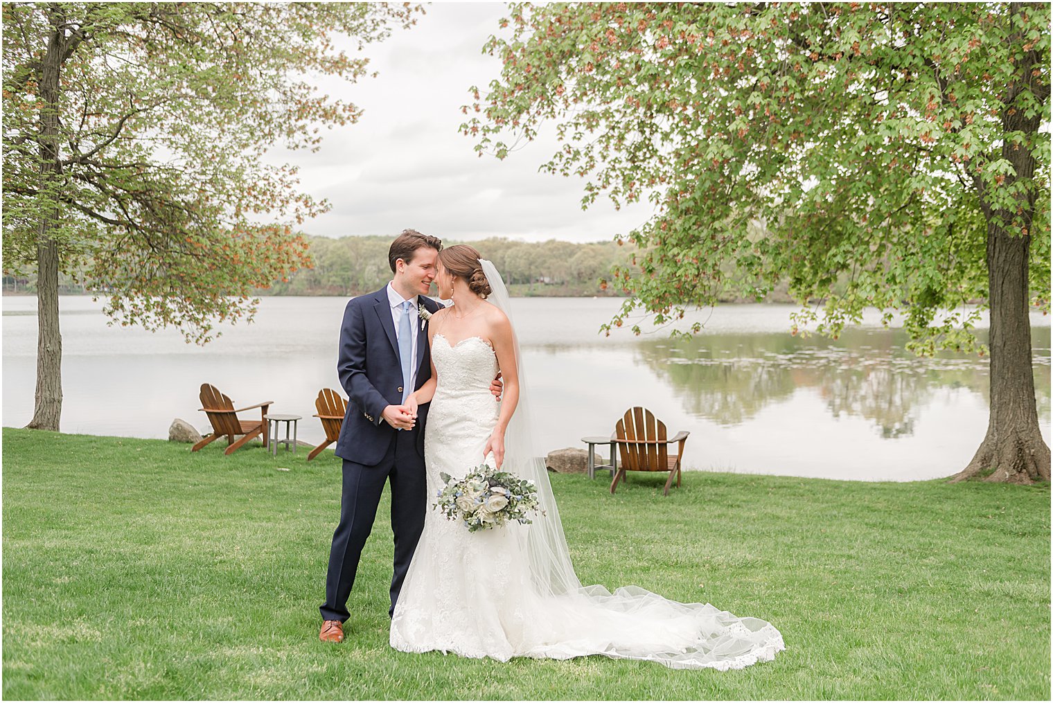 bride and groom stand on lawn at Indian Trail Club