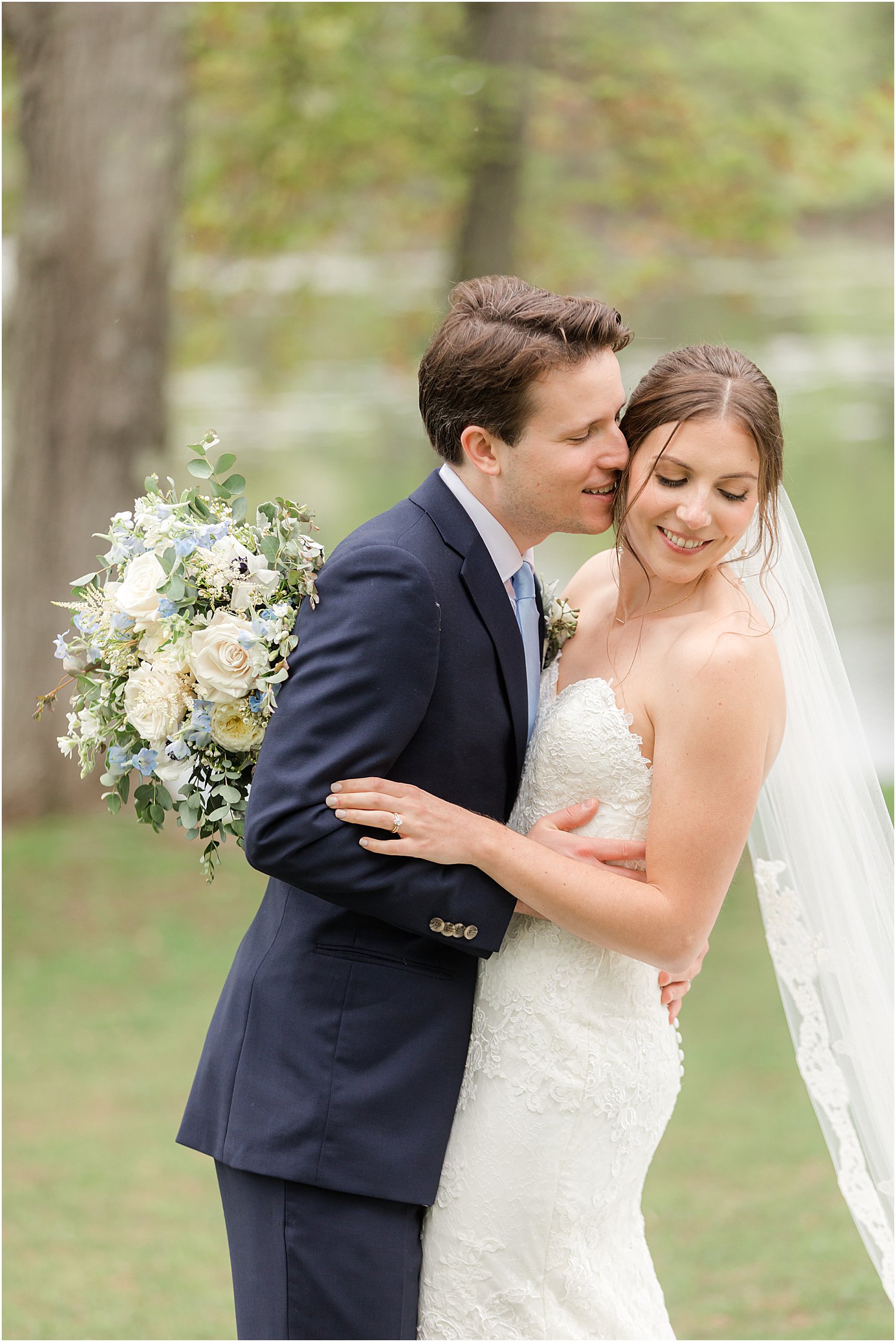 groom kisses bride's cheek during Franklin NJ wedding photos