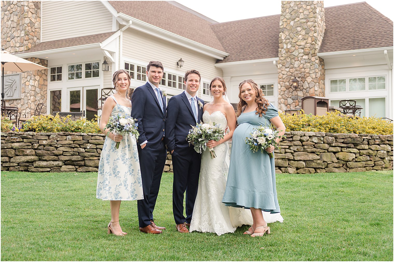 newlyweds pose with wedding party before Indian Trail Club wedding celebration