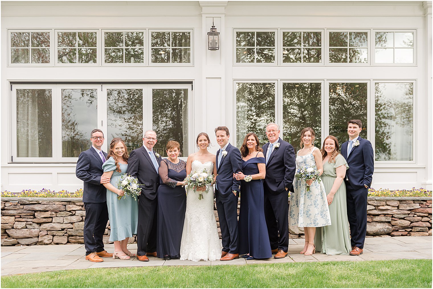 family portrait with bride and groom before Indian Trail Club wedding celebration