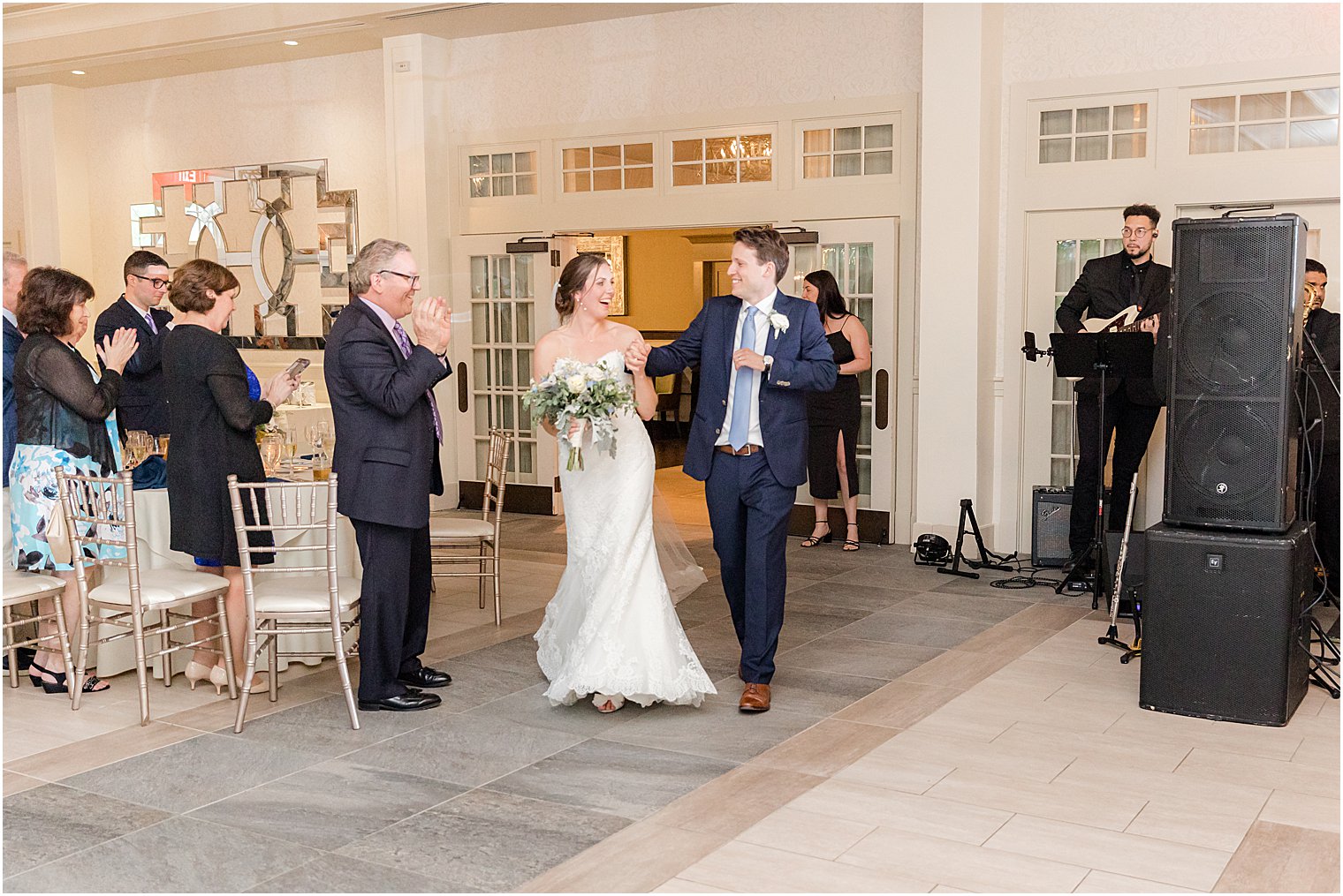 bride and groom enter wedding reception