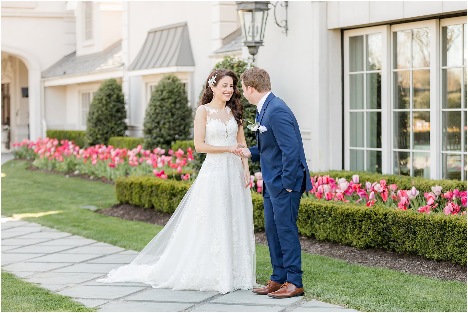 groom turns to see bride during first look outside Park Chateau Estate