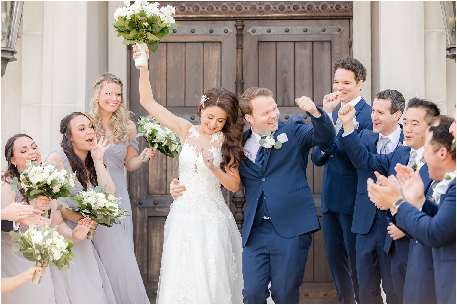 newlyweds dance with wedding party outside chapel of Park Chateau Estate