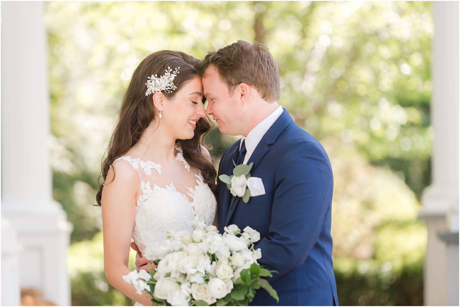 bride and groom lean noses together in NJ wedding photos