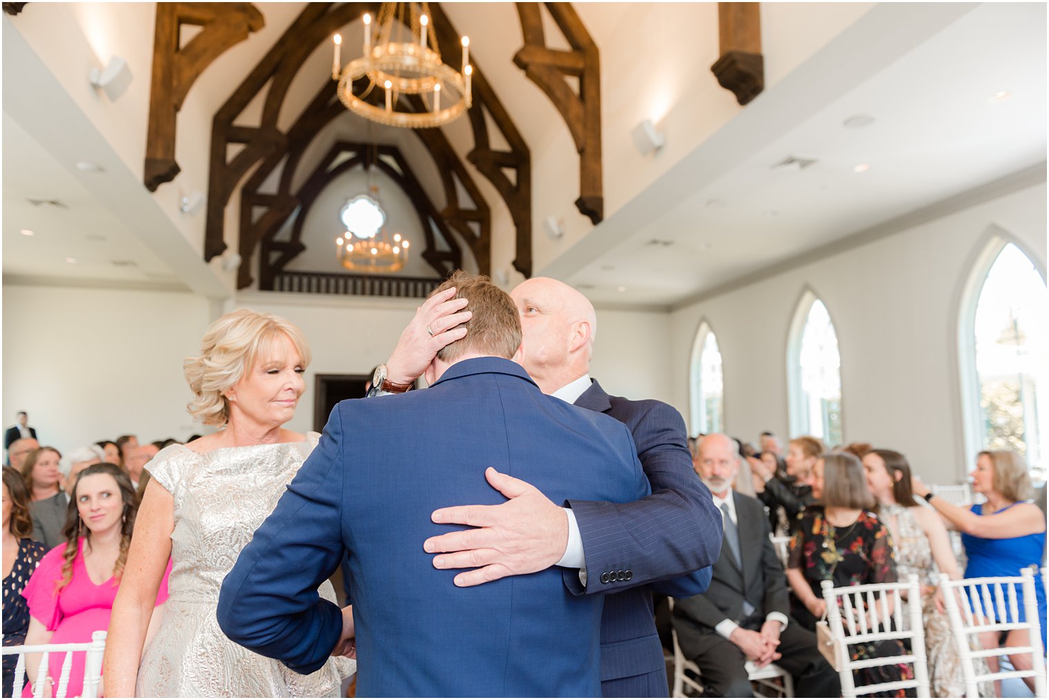 dad kisses son's head during NJ wedding ceremony in Park Chateau chapel