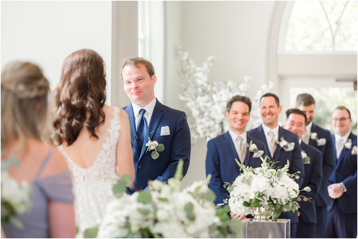 groom smiles at bride during Park Chateau chapel