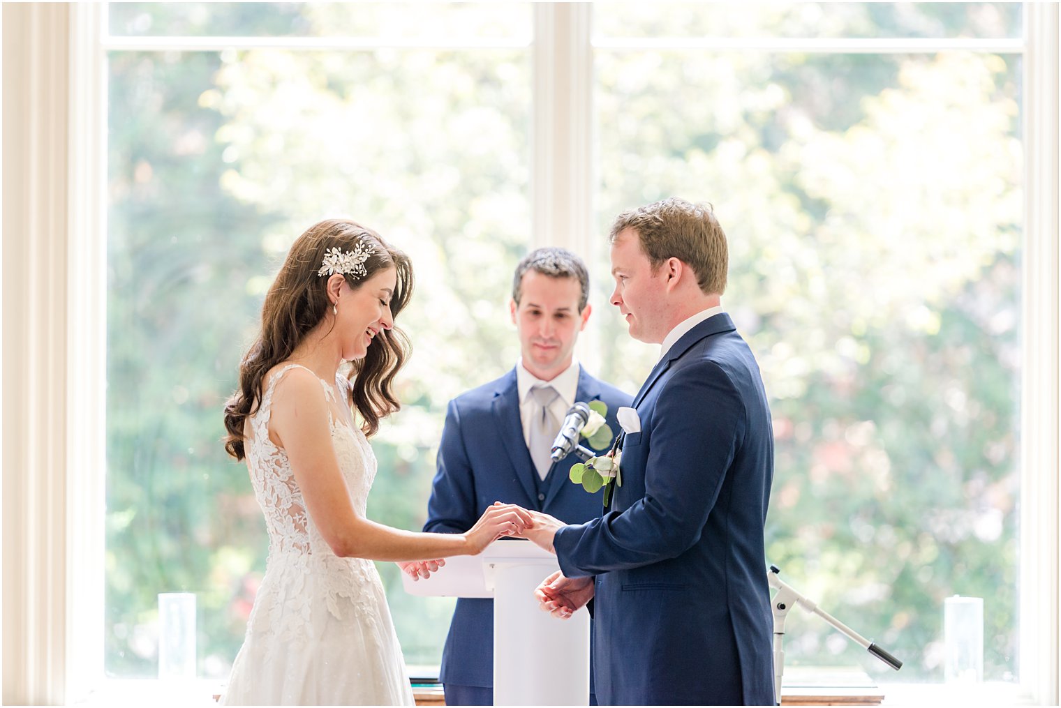 couple exchanges rings during NJ wedding ceremony