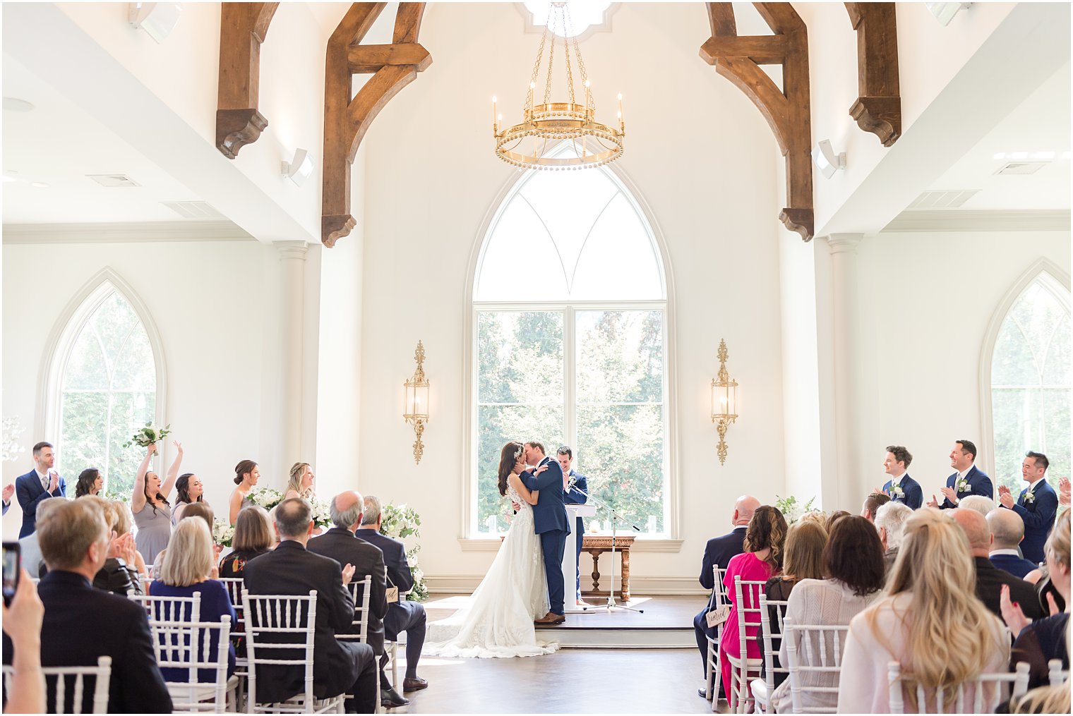 bride and groom kiss during Park Chateau chapel