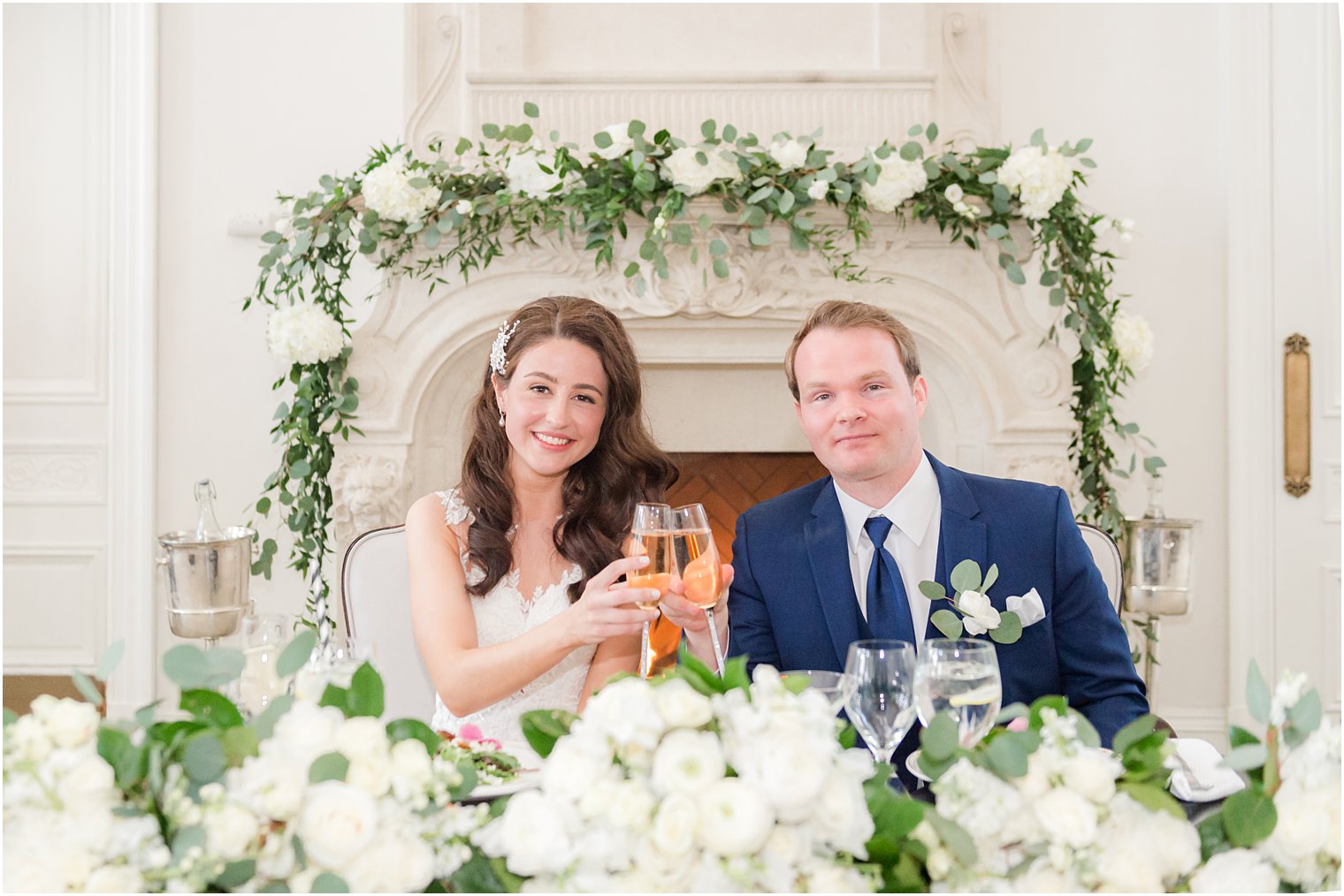 couple toasts at sweetheart table during East Brunswick NJ wedding reception