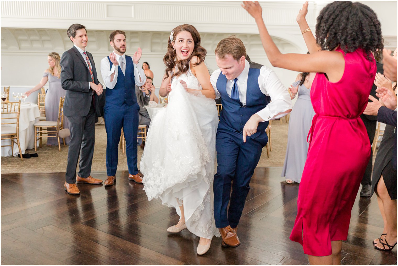 newlyweds dance with guests during East Brunswick NJ wedding reception