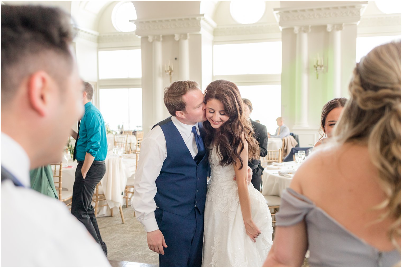 groom kisses bride on dance floor during East Brunswick NJ wedding reception