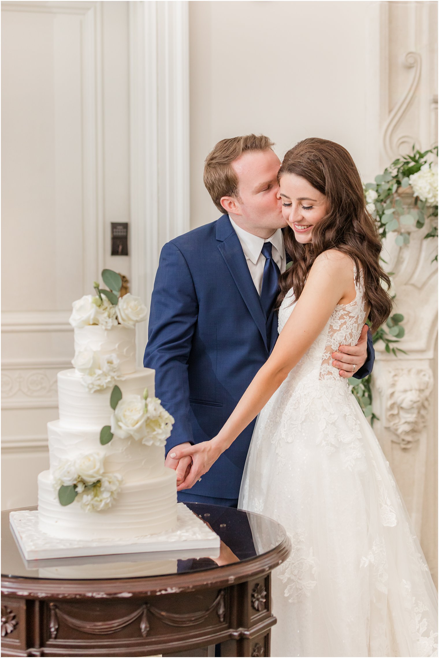 bride and groom cut wedding cake during East Brunswick NJ wedding reception