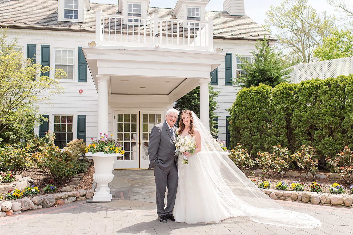 bride stands with dad during family formals