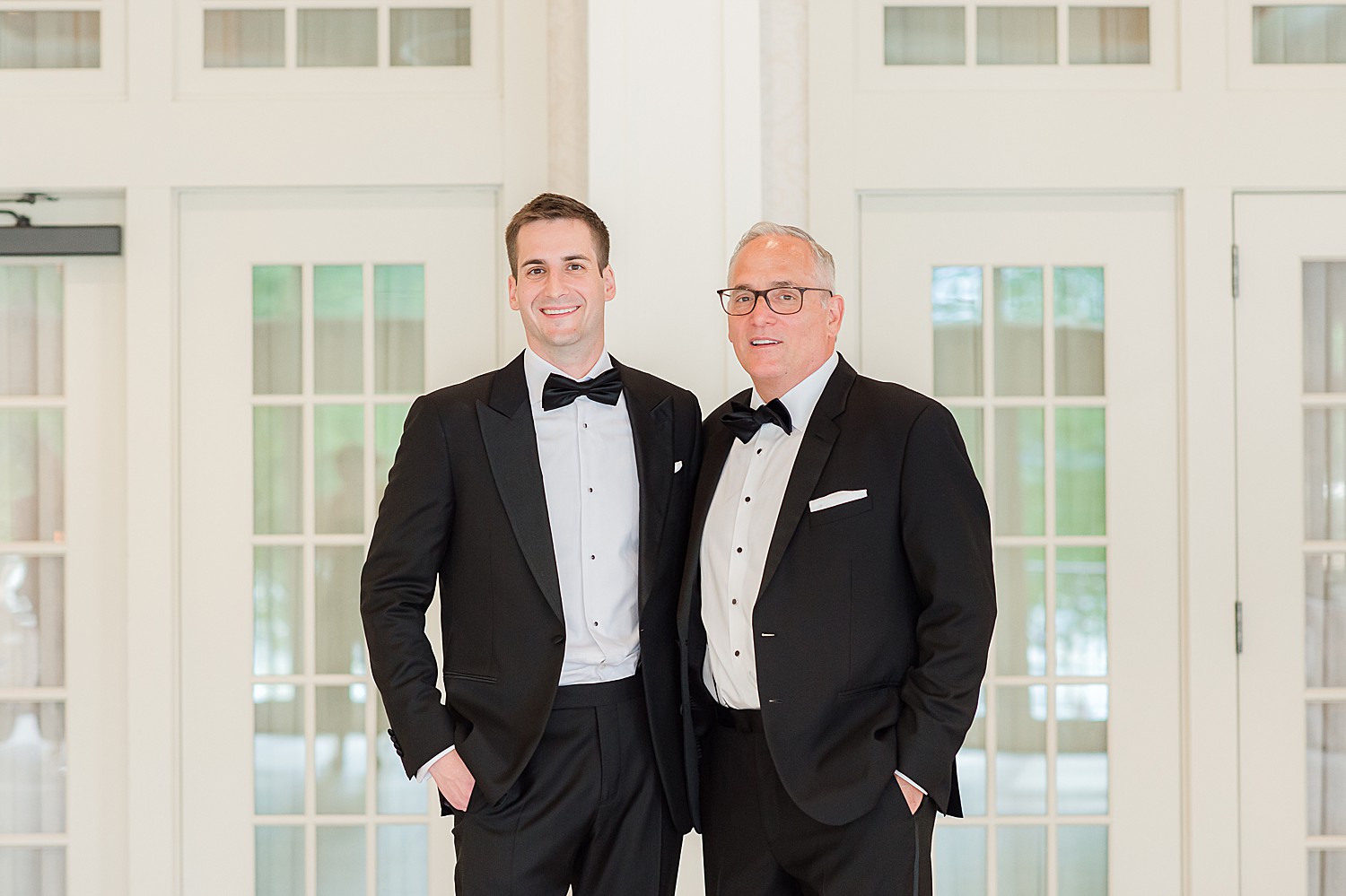 father and son during family formals on wedding day