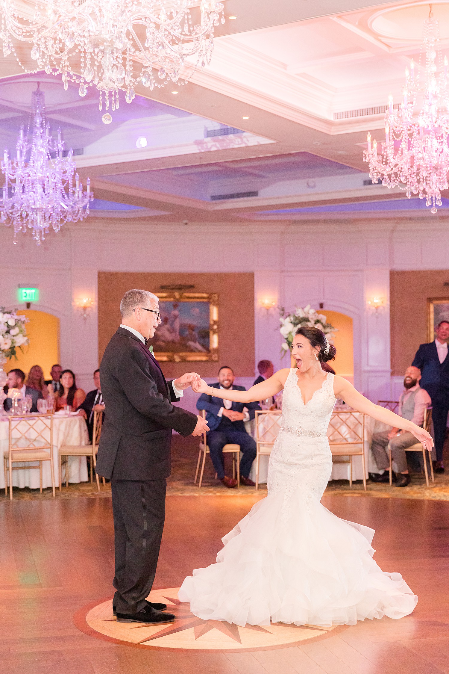 bride and father have fun during dance together at reception