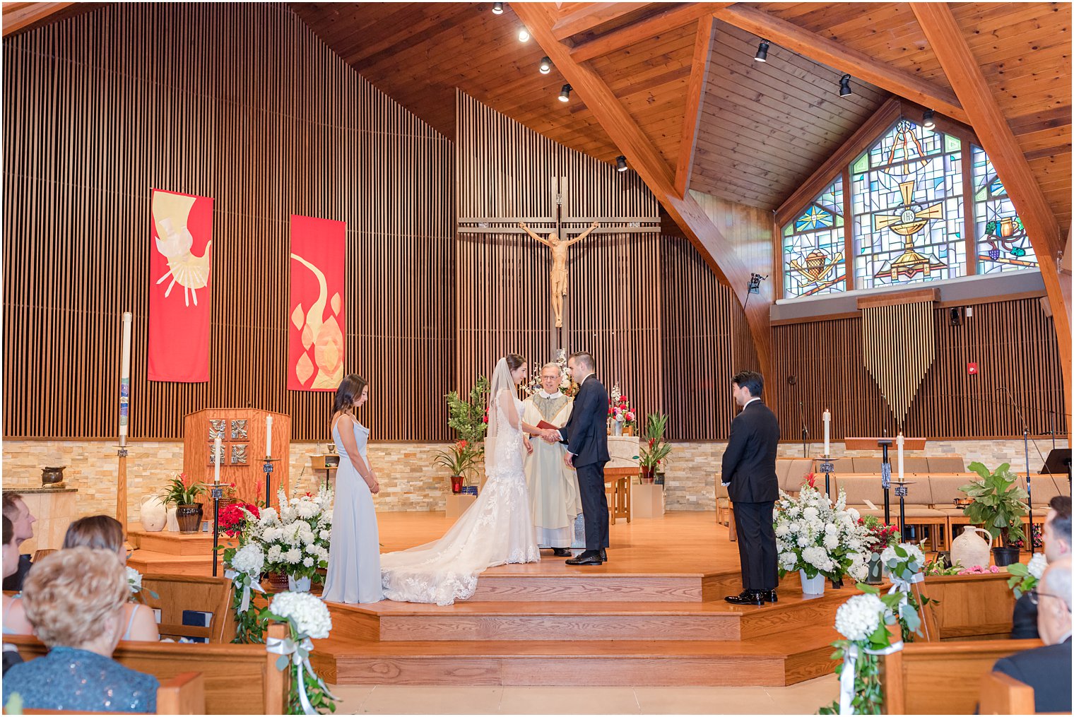 newlyweds exchange vows during traditional church wedding ceremony in New Jersey