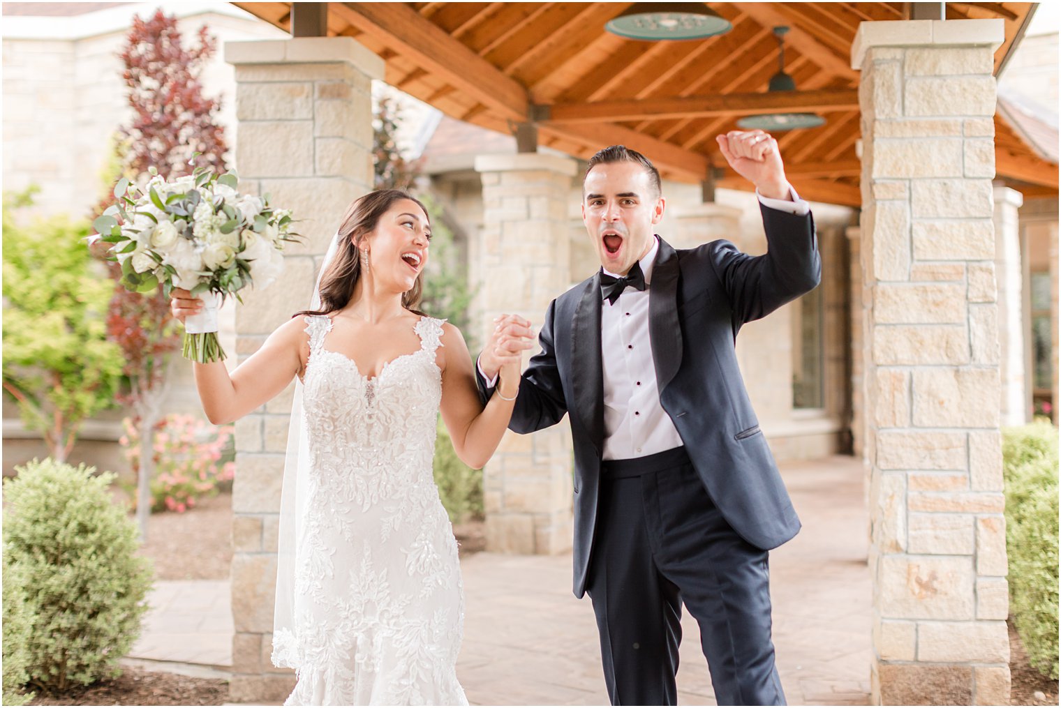 newlyweds cheer after traditional church wedding ceremony in New Jersey