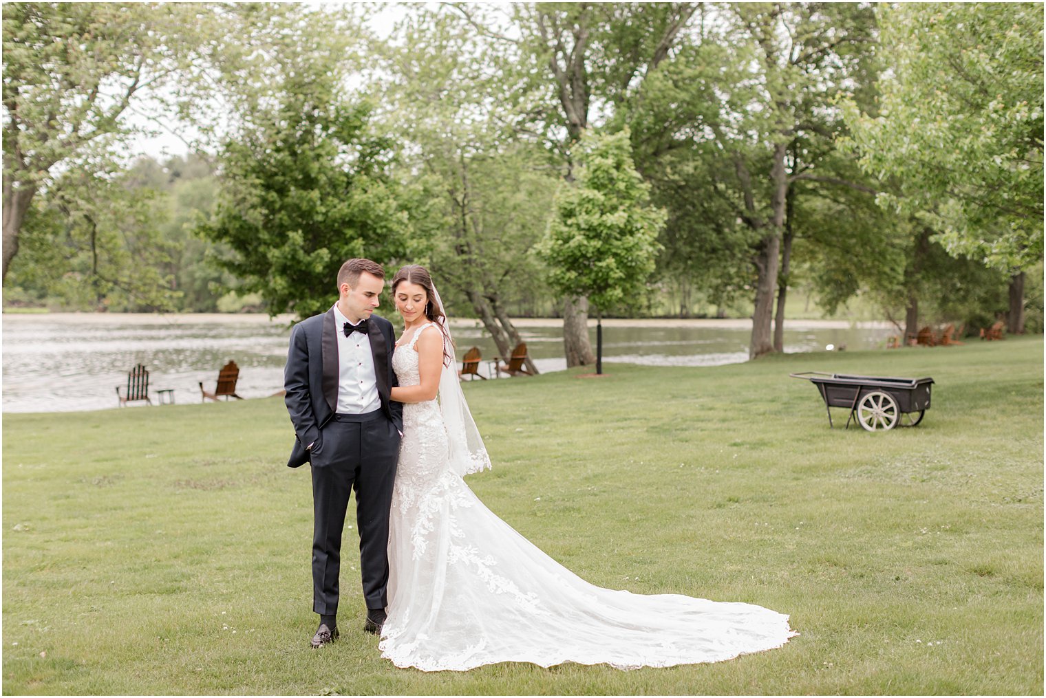 bride and groom stand together on lawn at Indian Trail Club