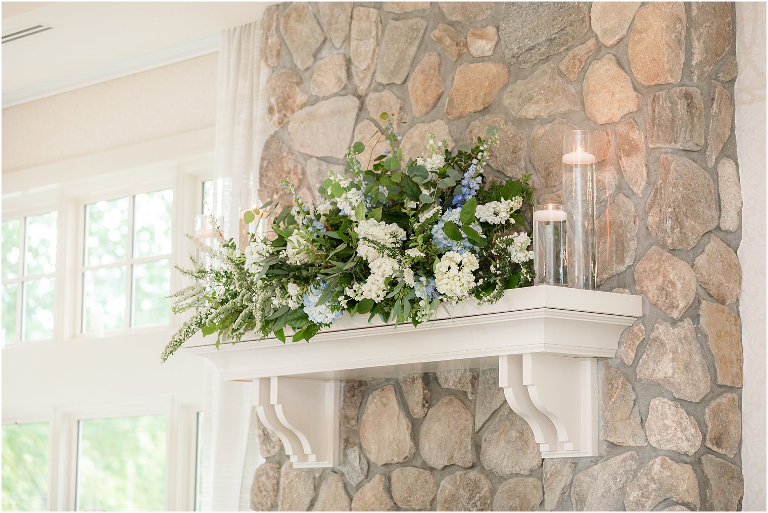 white and green floral display on shelves at Indian Trail Club