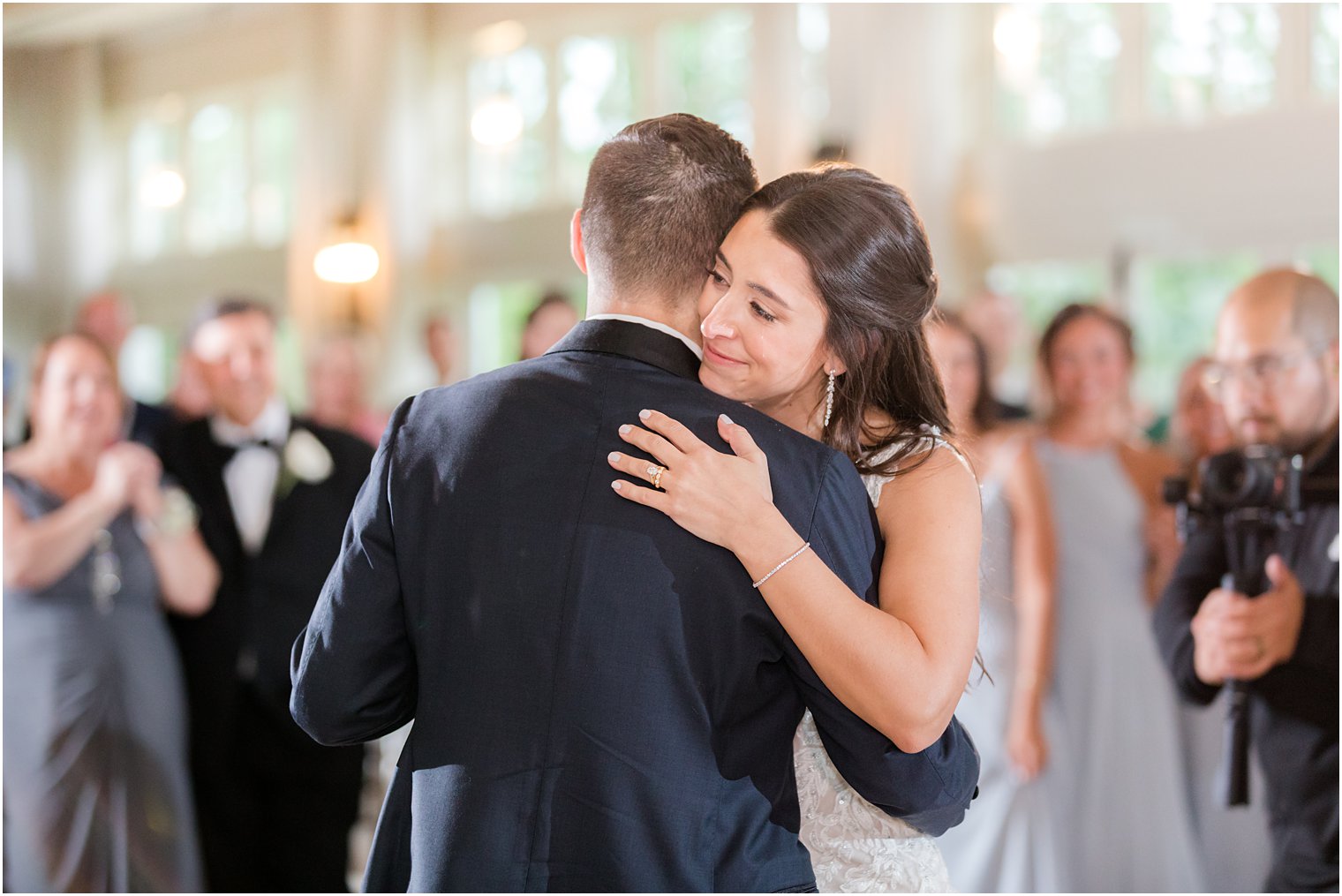 bride hugs groom during NJ wedding reception