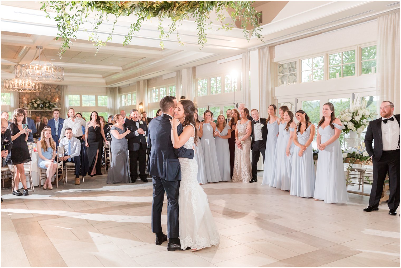 bride and groom hug on dance floor during NJ wedding reception