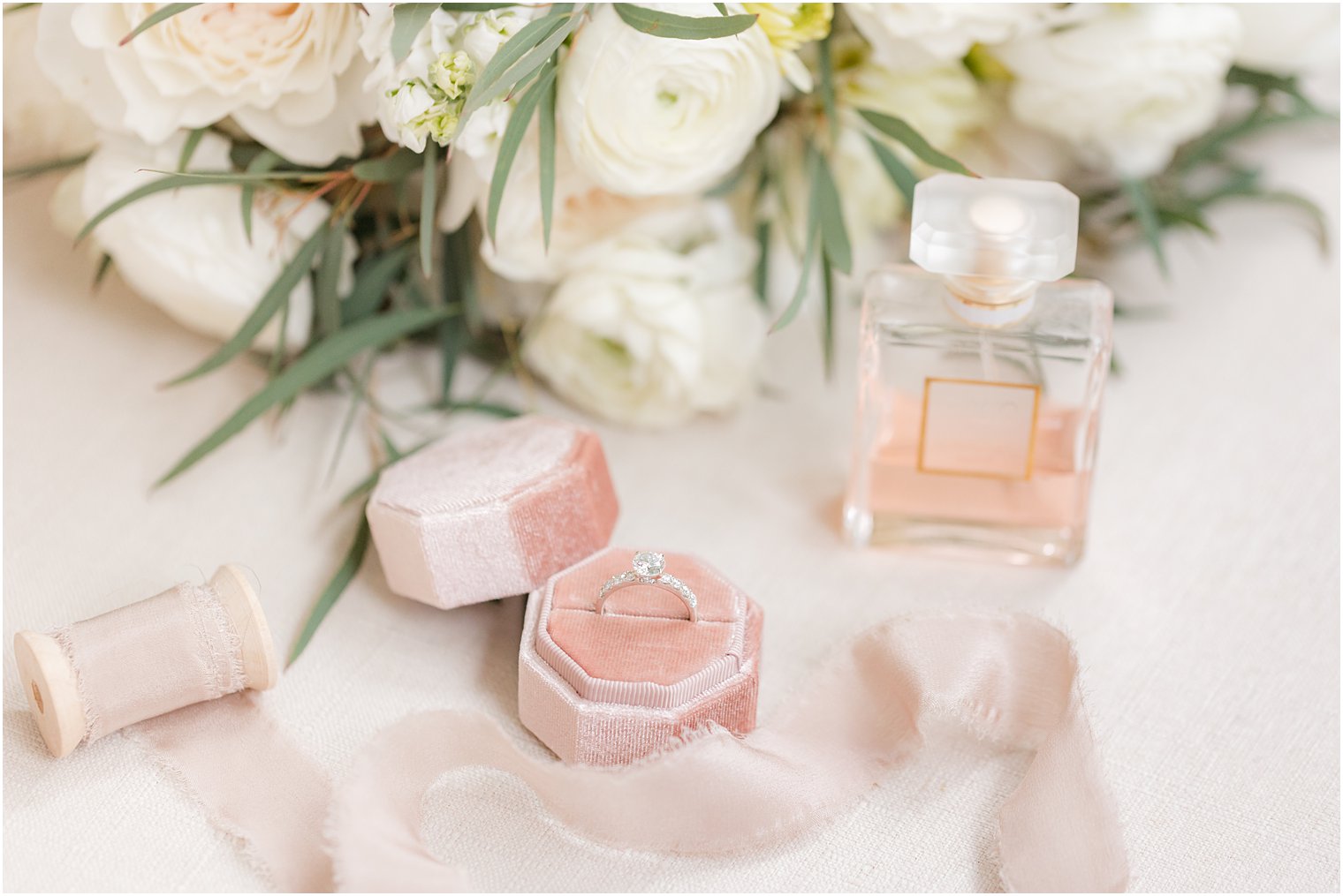 bride's wedding ring sits in pink box during Collingswood Grand Ballroom wedding day prep