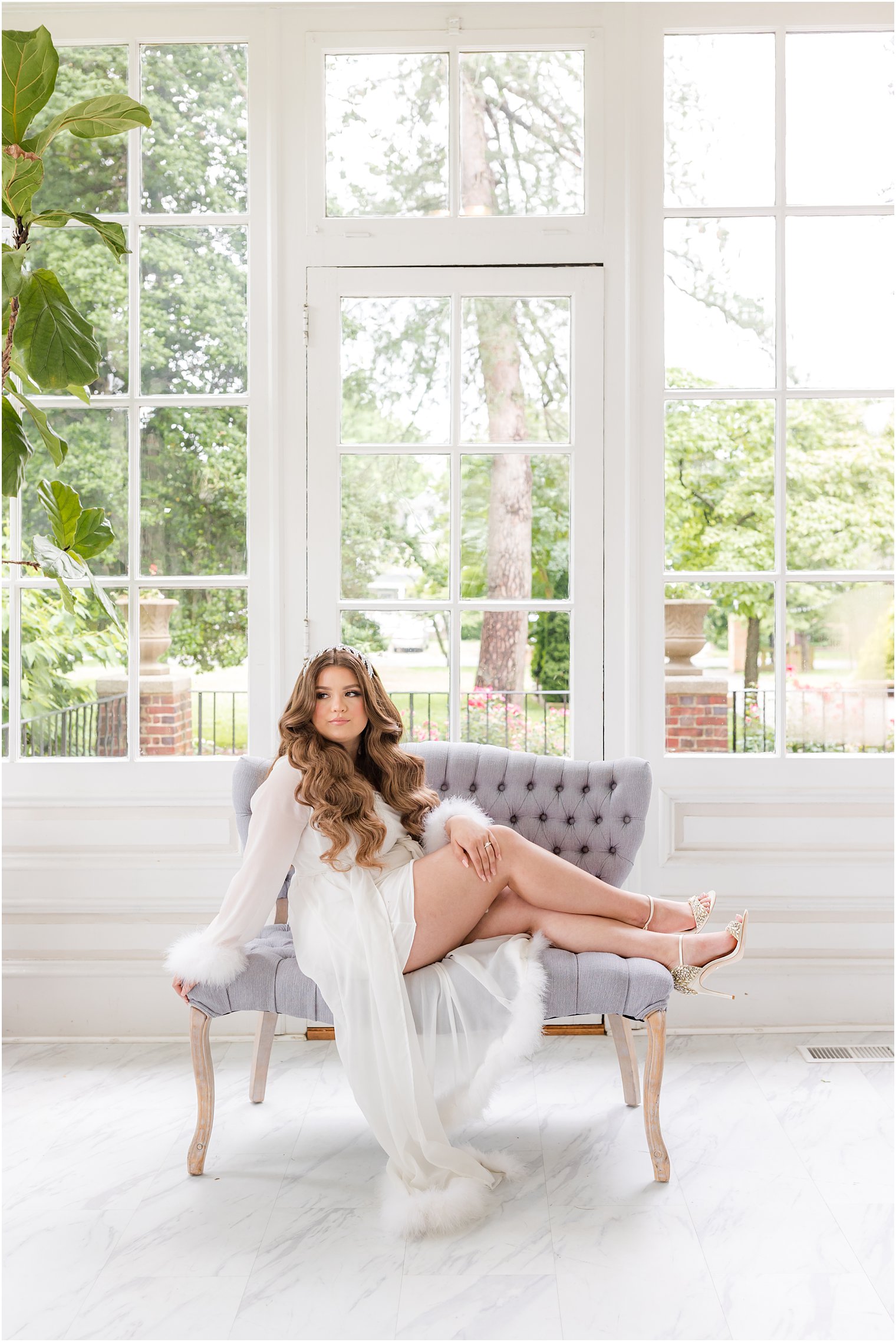 bride sits on grey chair at Collingswood Grand Ballroom