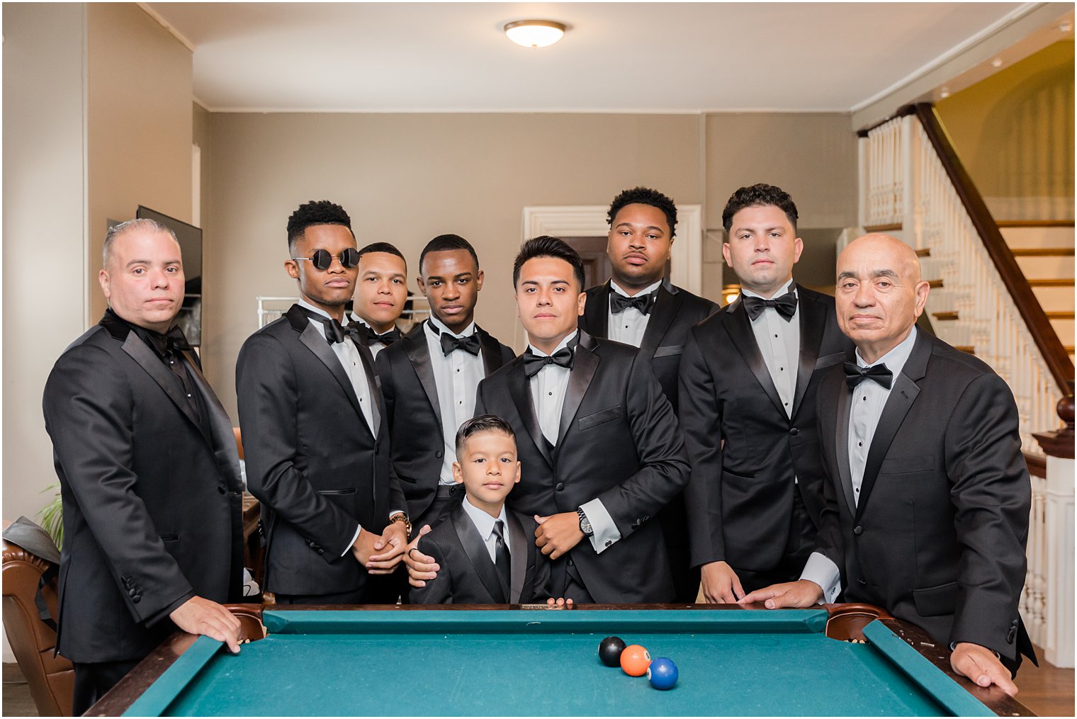 groomsmen pose by pool table at Collingswood Grand Ballroom