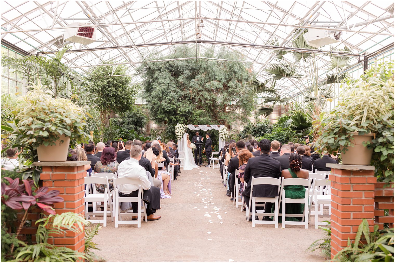 Fairmont Park Horticulture Center wedding ceremony in greenhouse