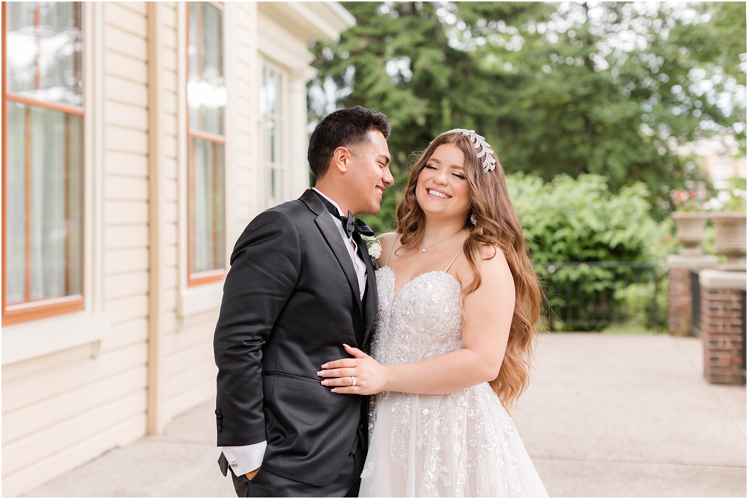 bride and groom laugh outside Collingswood Grand Ballroom