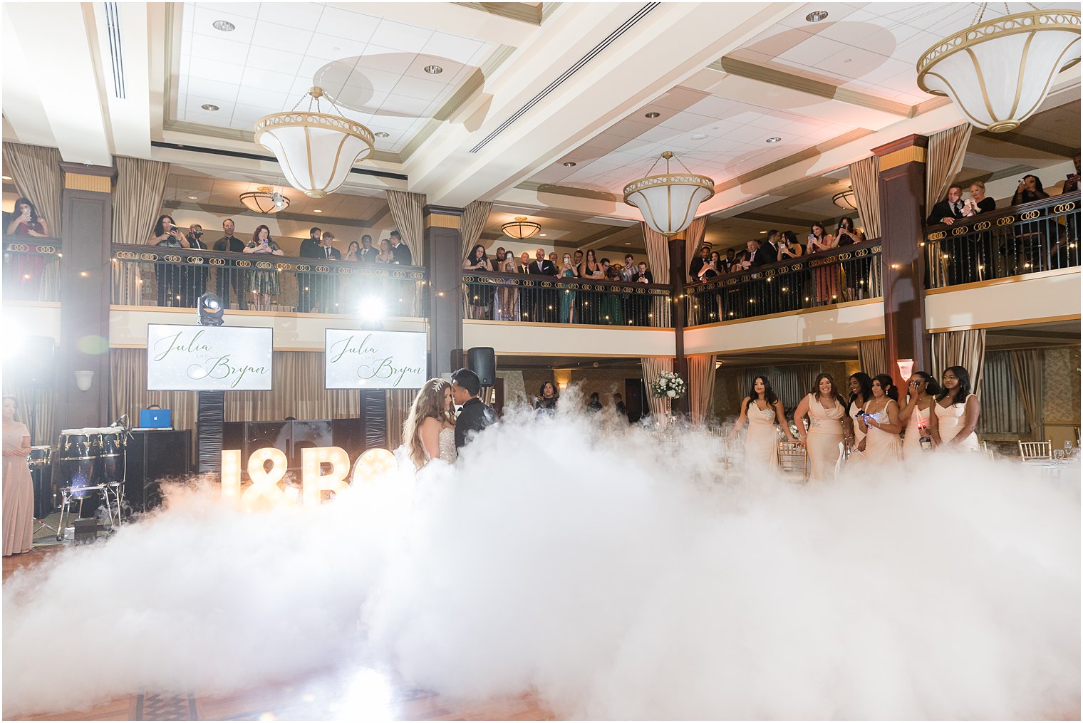 bride and groom have first dance on dance floor with fog at Collingswood Grand Ballroom