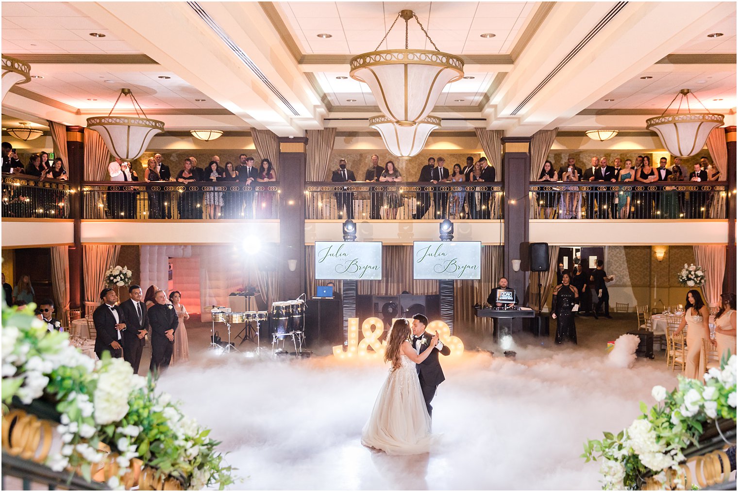 bride and groom have first dance on dance floor with fog at Collingswood Grand Ballroom