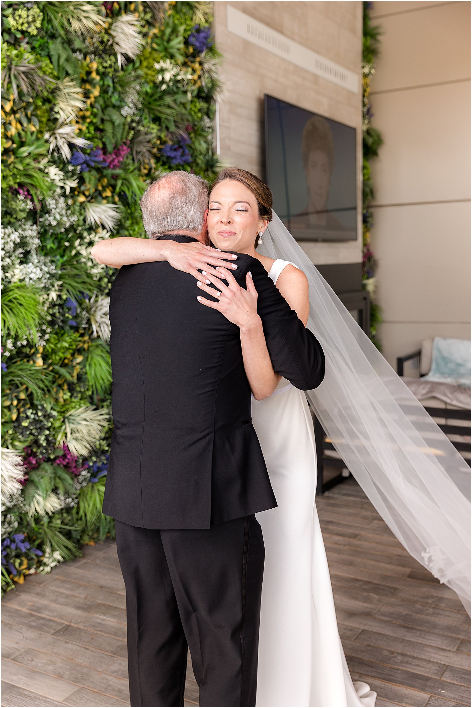 bride hugs groom during first look at Ryland Inn