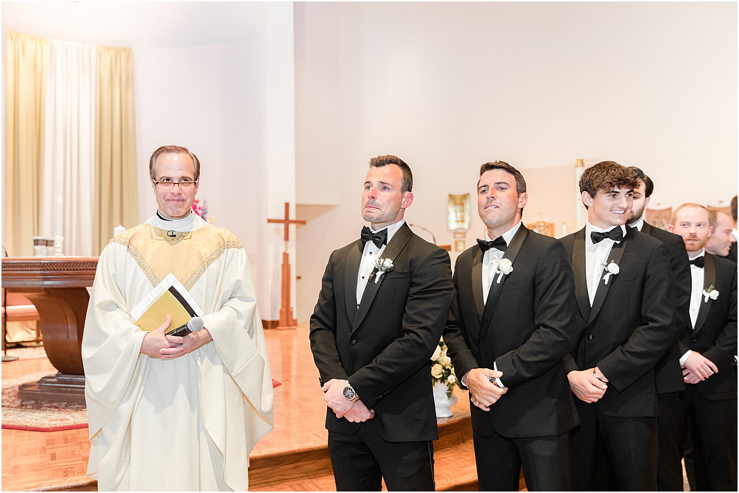 groom watches bride enter wedding ceremony at St. Joseph Roman Catholic Church