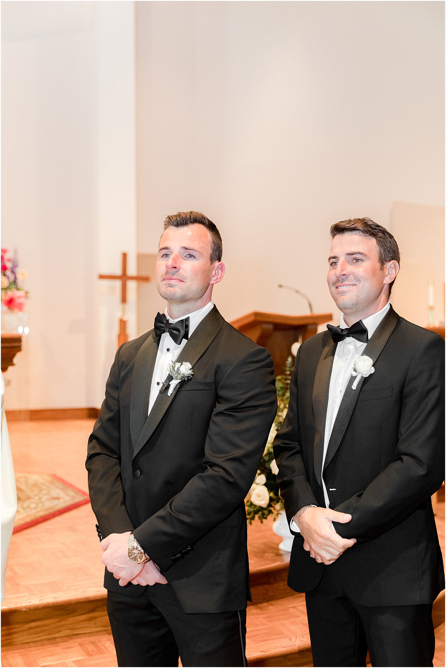 groom crises watching bride walk down aisle for ceremony at St. Joseph Roman Catholic Church