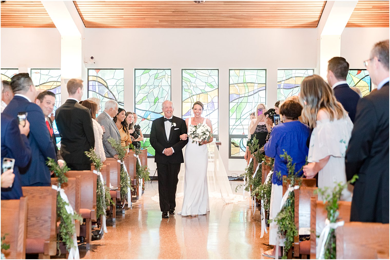 bride and dad walk down aisle for ceremony at St. Joseph Roman Catholic Church