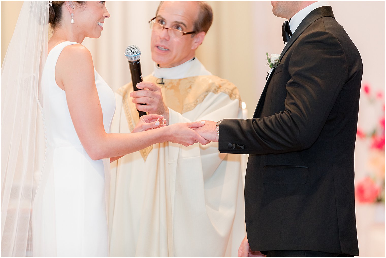 couple recites vows during traditional ceremony at St.Joseph Roman Catholic Church