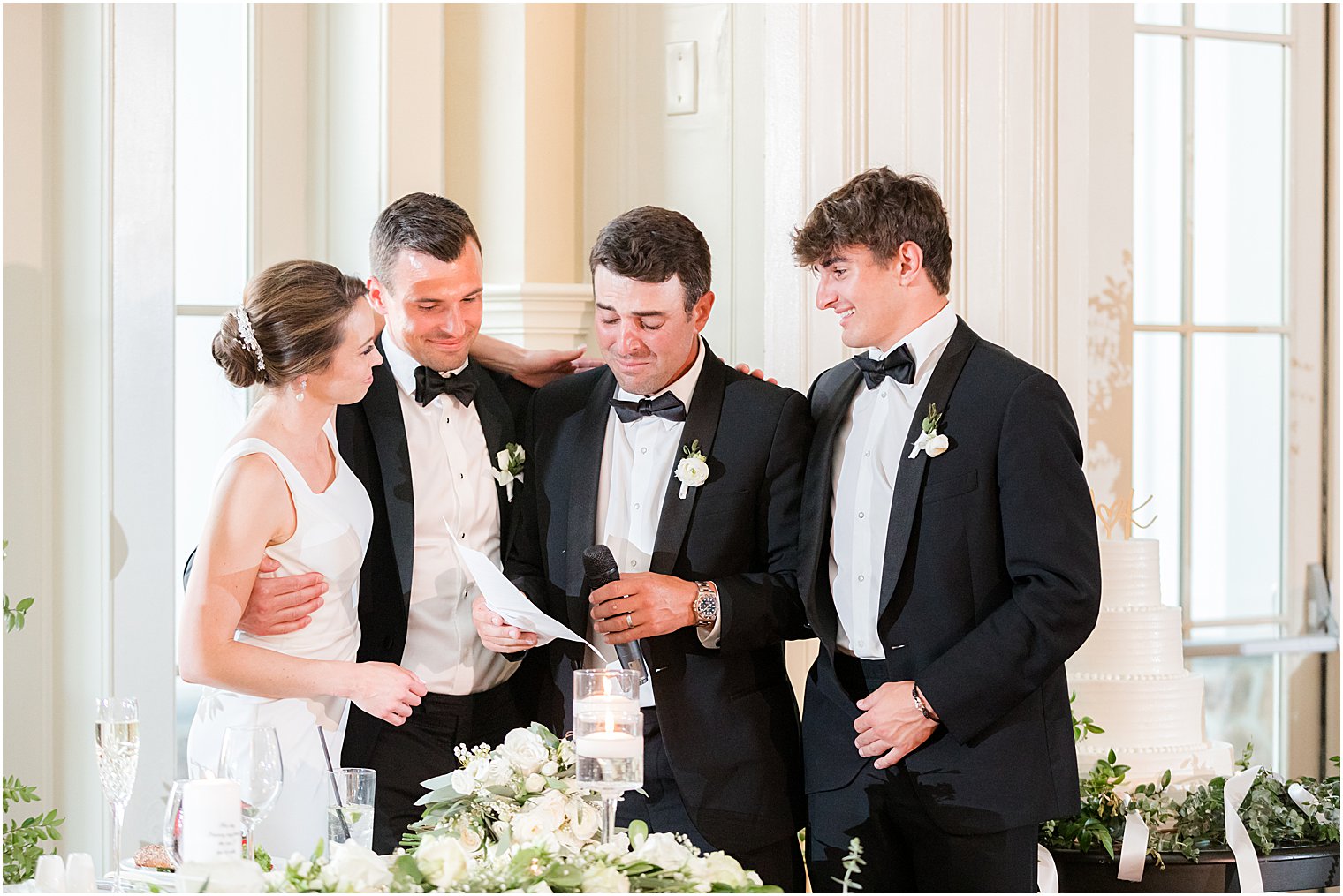 brothers hug bride during toasts at Whitehouse Station NJ wedding reception