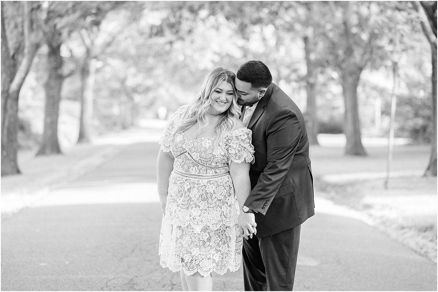 groom kisses bride's neck during NJ engagement session