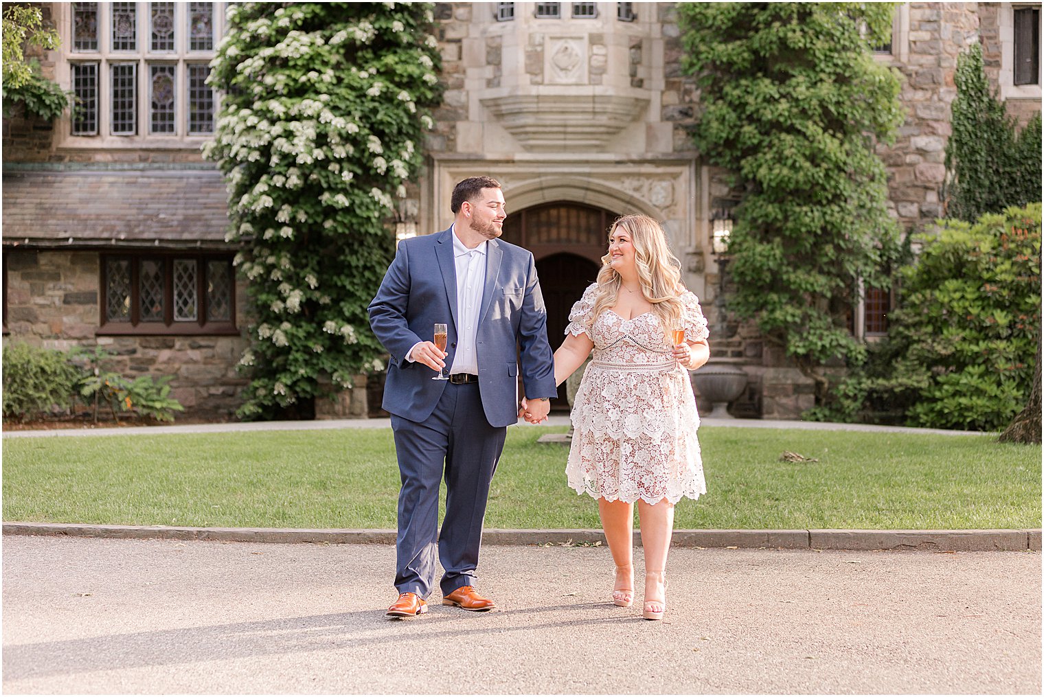 engaged couple walks outside Skylands Manor