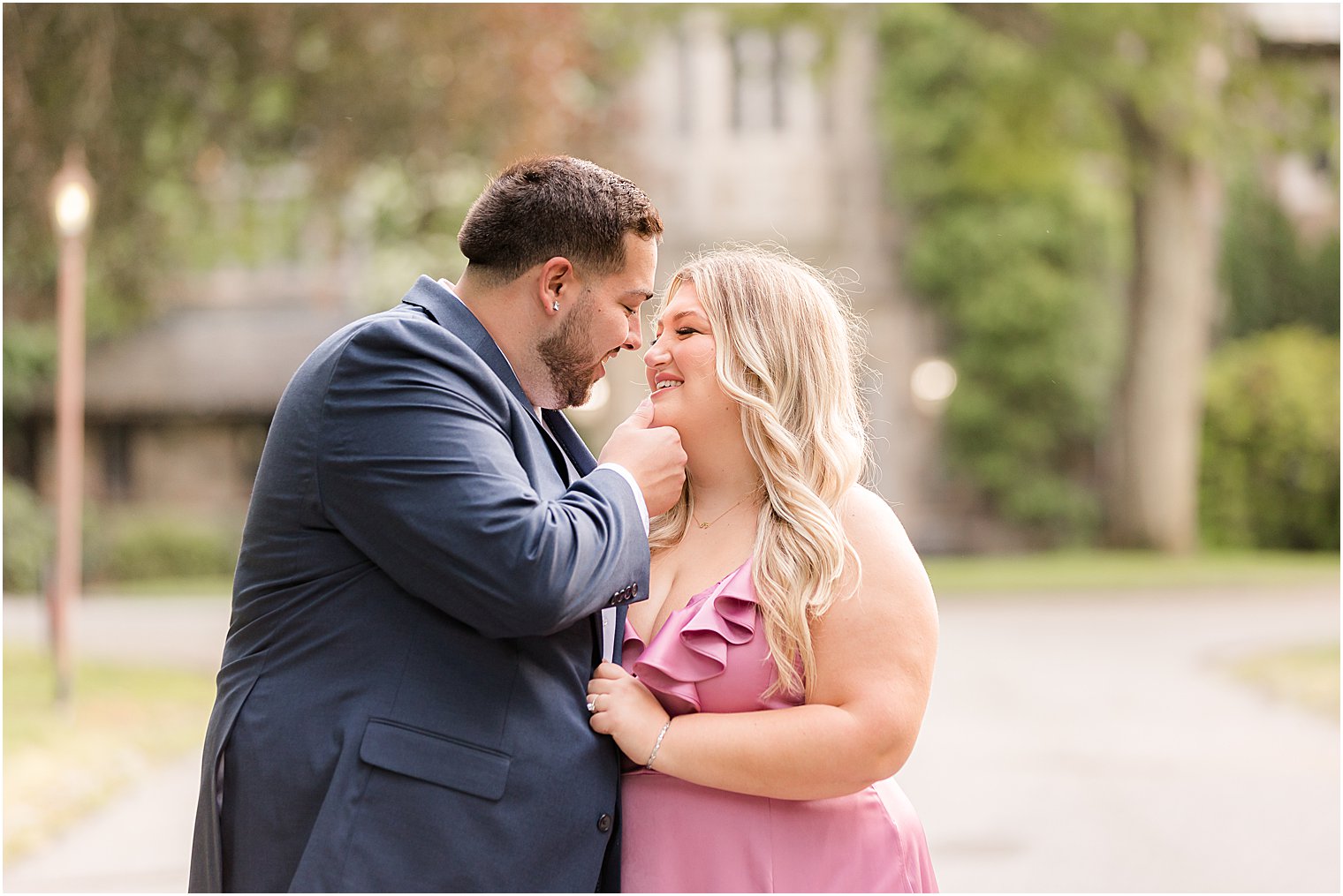 bride and groom lean in for kiss outside Skylands Manor