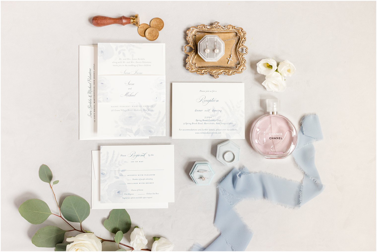 timeless invitation suite with blue ribbon and wax seal 