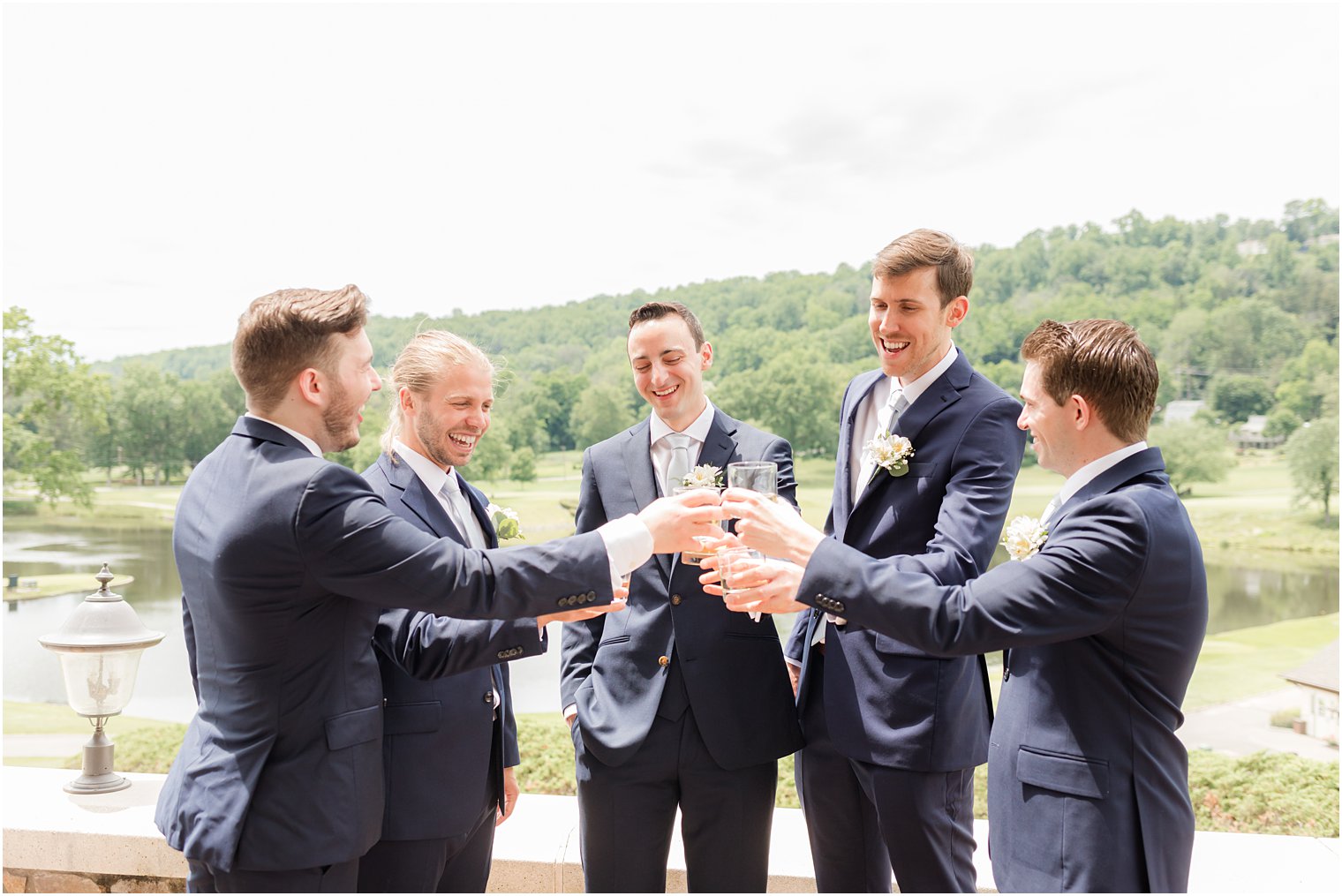 groom and groomsmen toast before Spring Brook Country Club wedding