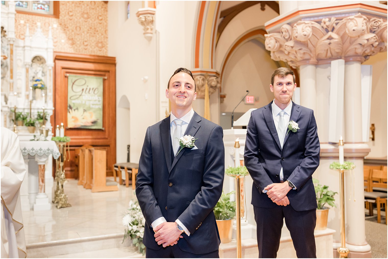 groom watches bride enter ceremony at St. Vincent Martyr Church