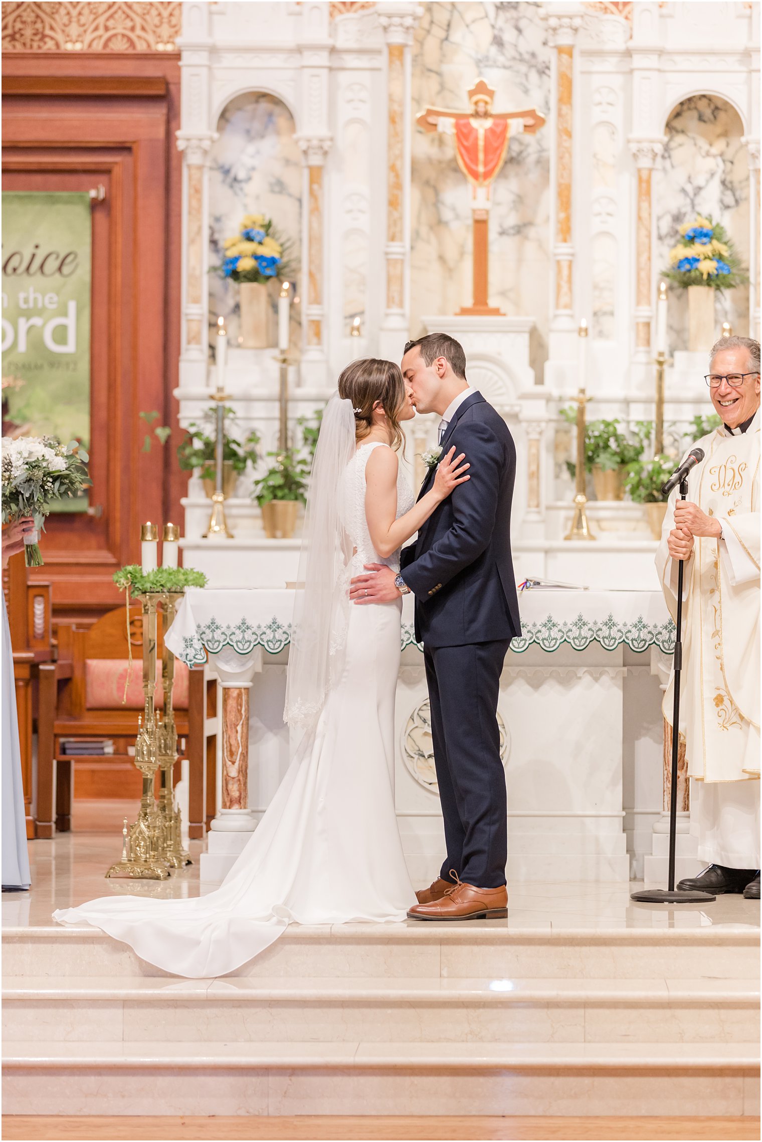 newlyweds kiss during St. Vincent Martyr Church wedding ceremony 