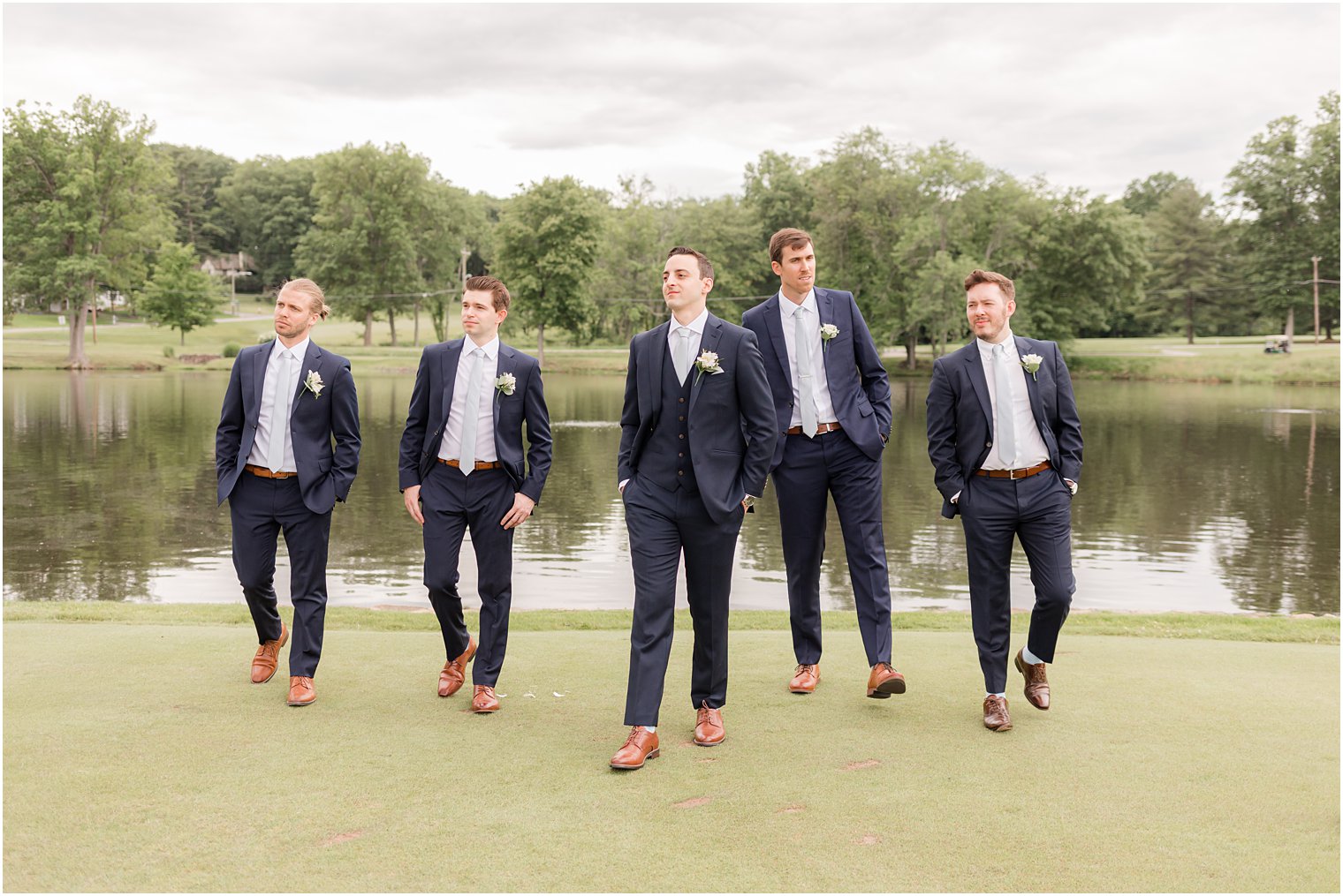 groom and groomsmen walk around at Spring Brook Country Club