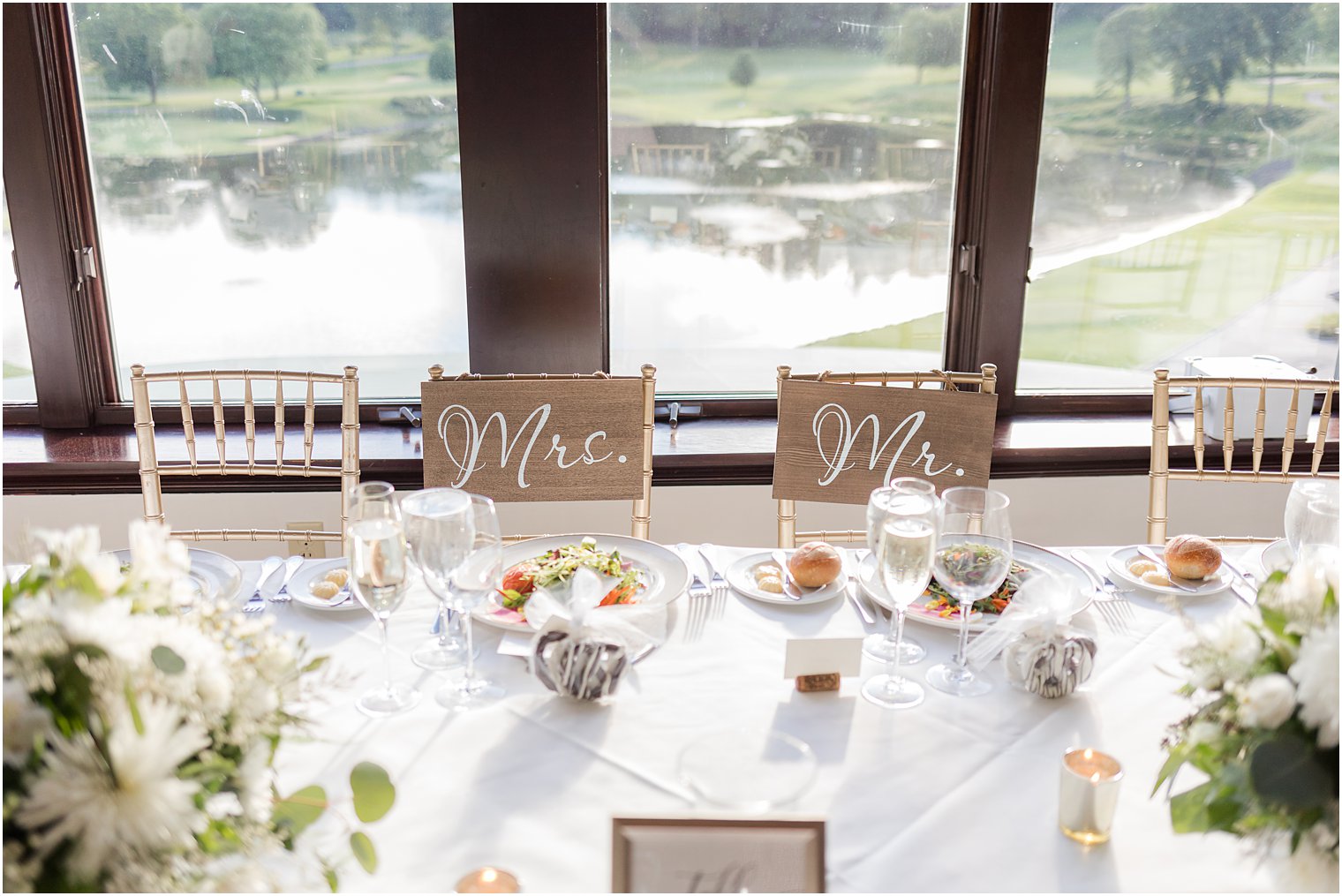 sweetheart table with wooden Mr and Mrs signs