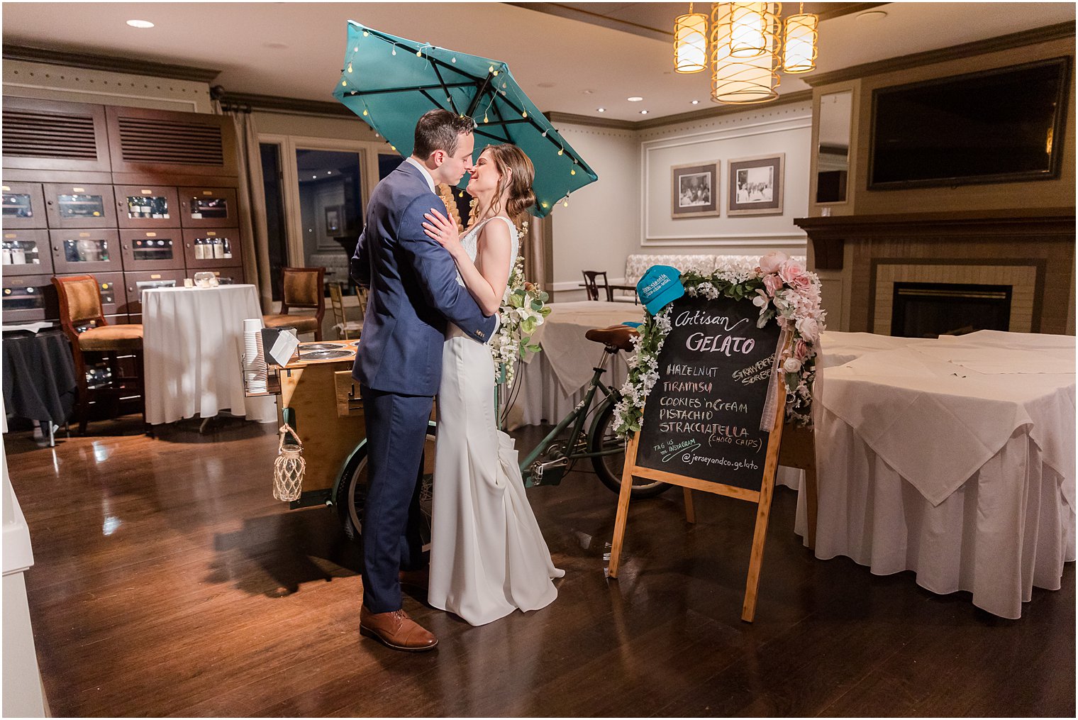 bride and groom kiss by gelato truck at Spring Brook Country Club