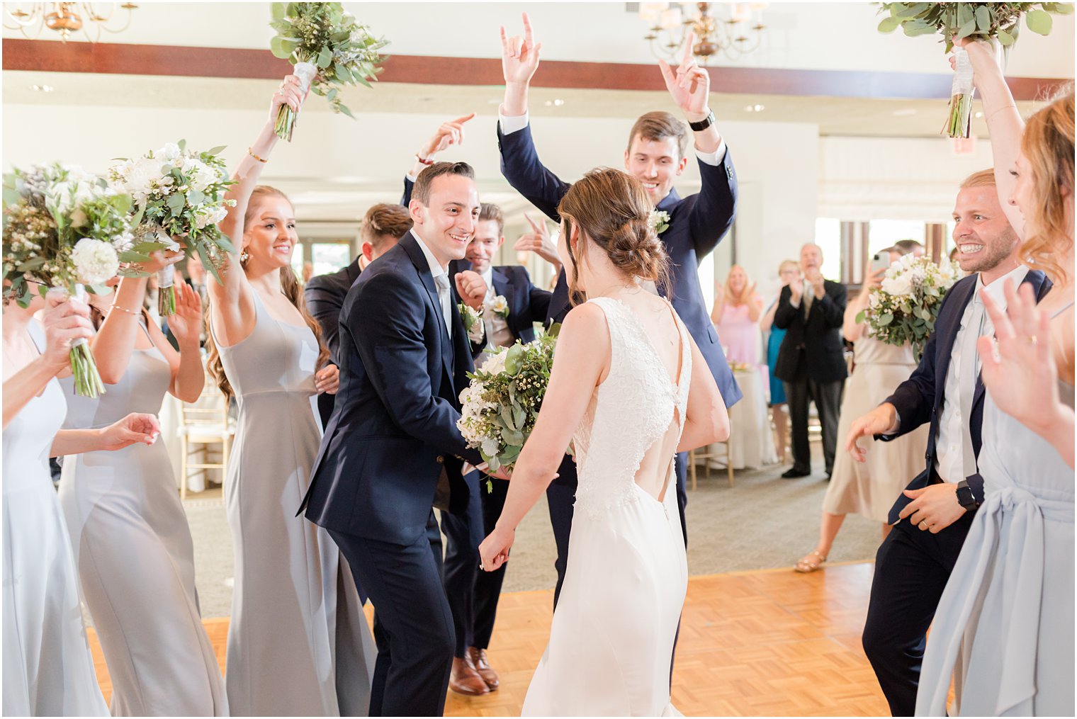 newlyweds dance with guests during Morristown NJ wedding reception